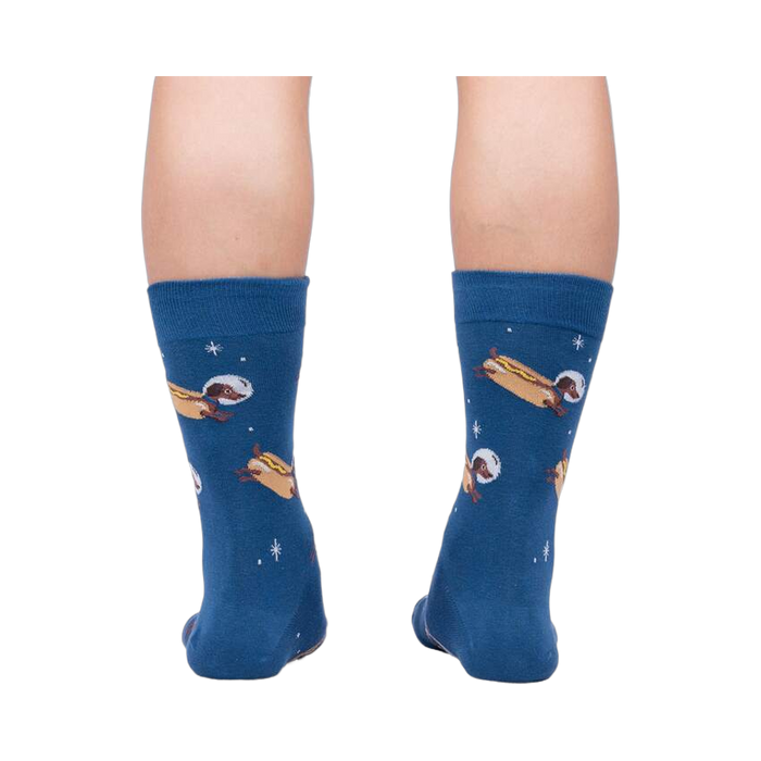 Rear view of the 'Weiner Dogs, In Space!' socks on a person's legs.