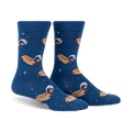 Crew socks in dark blue featuring dachshunds dressed as astronauts on hot dogs floating in space.  Fun and quirky design.
