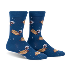 Crew socks in dark blue featuring dachshunds dressed as astronauts on hot dogs floating in space.  Fun and quirky design.