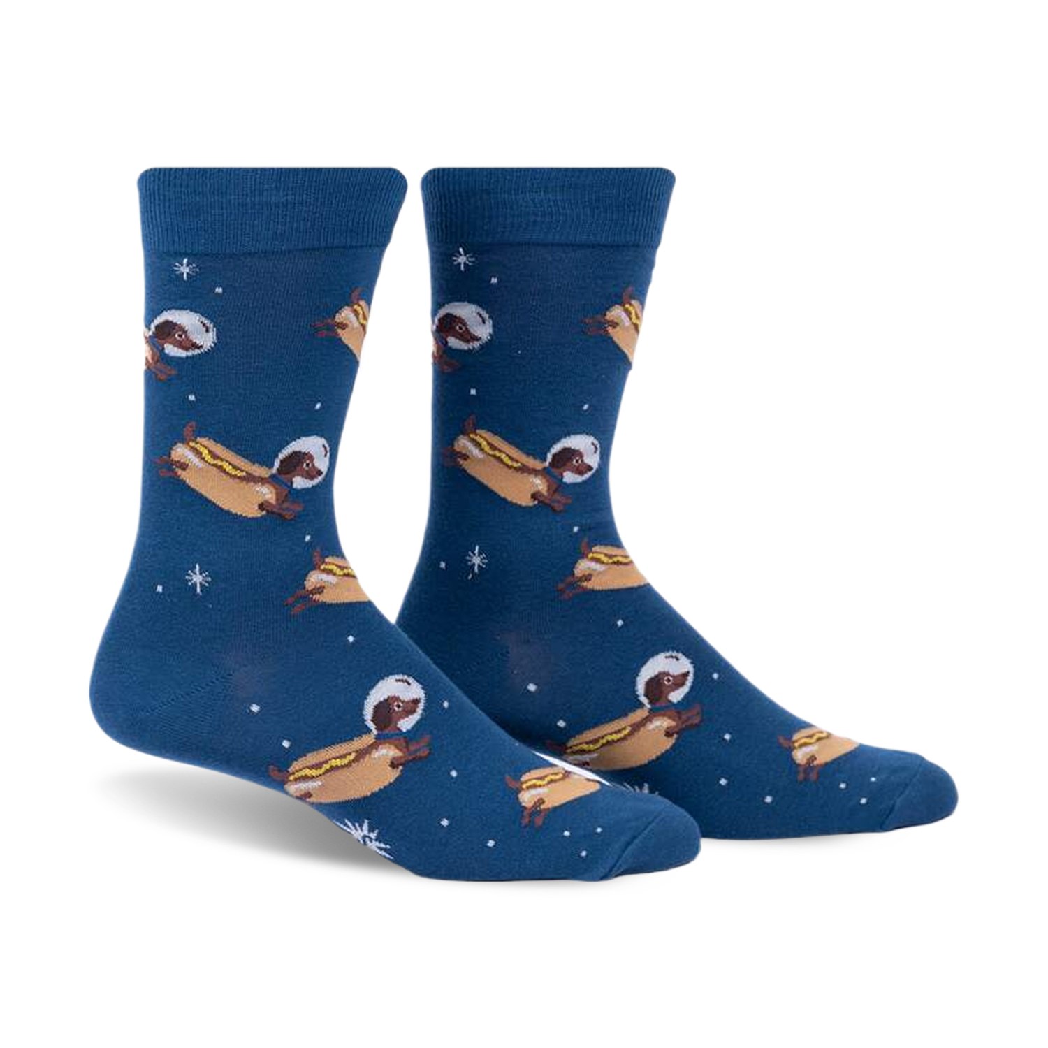 Crew socks in dark blue featuring dachshunds dressed as astronauts on hot dogs floating in space.  Fun and quirky design.