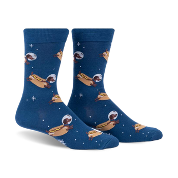 front view of a pair of blue socks with a pattern of dachshunds wearing astronaut helmets and floating in space. the dachshunds are dressed as hot dogs.