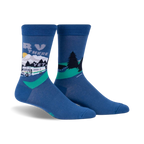 Pair of blue crew socks with a graphic design of an RV driving through a mountain landscape.  Features a whimsical sun and green trees.
