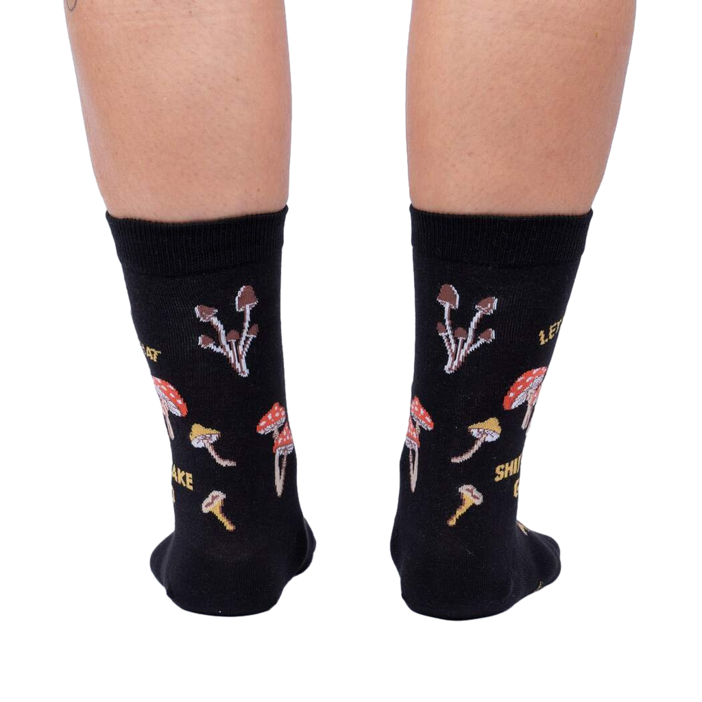 Close-up view of the back of the socks, highlighting the full mushroom pattern and text.