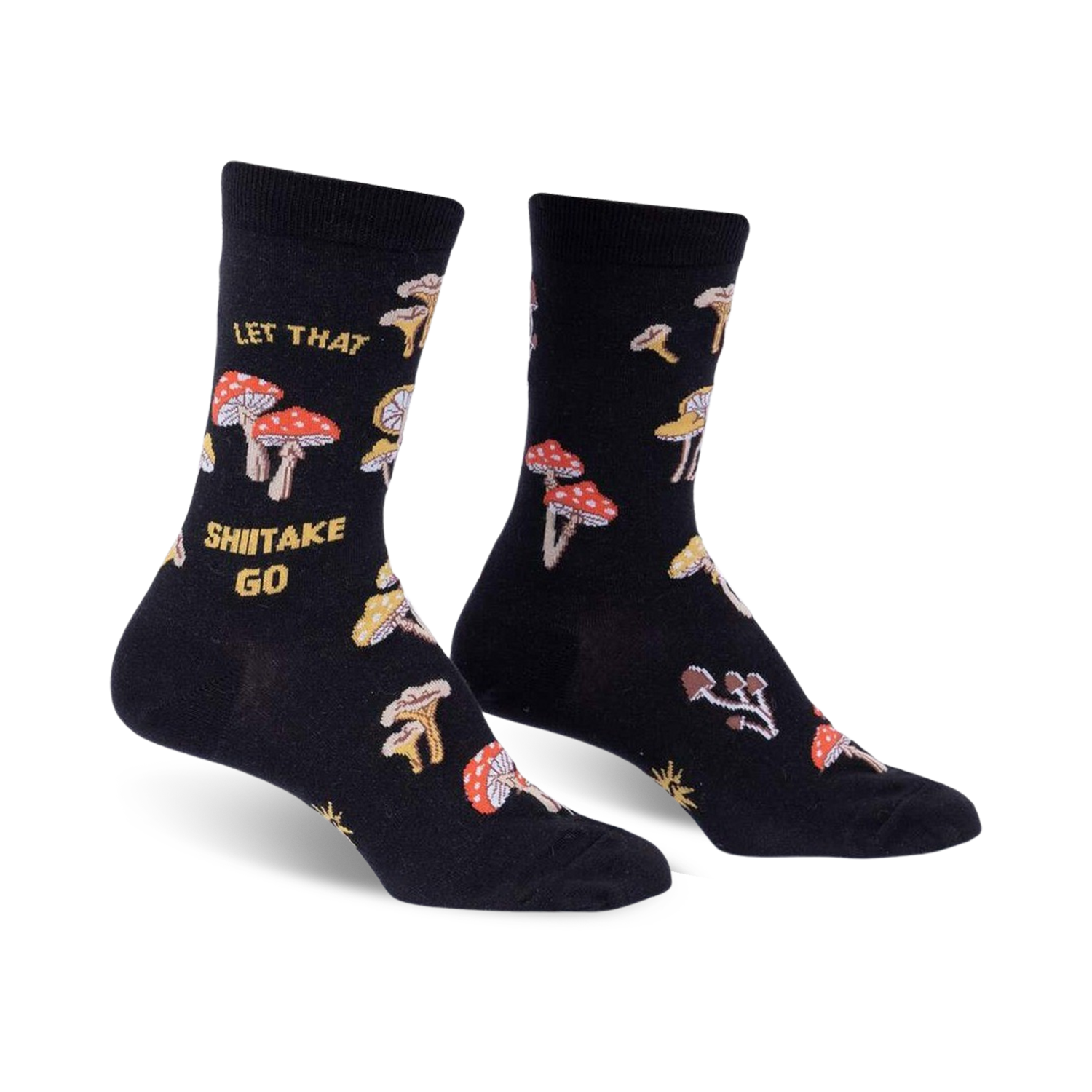 Pair of black crew socks with a whimsical mushroom and 'Let That Shiitake Go' design. Red and gold mushrooms are scattered across the black fabric.