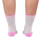 Rear view of 'Keep It Weird!' socks on a person's legs, showing the pink cuffs and subtle sock details.