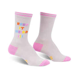 white socks feature 'keep it weird!' text in rainbow letters on left sock and right sock with pink heel & toe and sun graphic.  