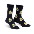 Pair of black crew socks featuring a repeating pattern of avocados with cute cat faces.  The avocados are light green and yellow.