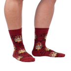 Lifestyle photo showing a person's legs wearing the Yule Log socks.