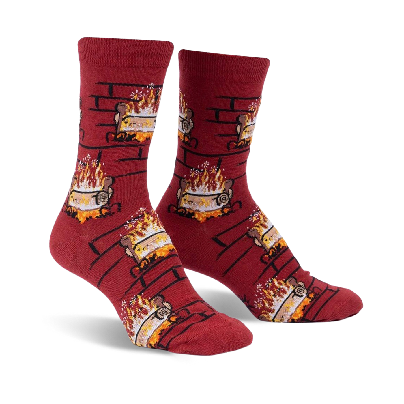 Pair of crew socks in burgundy with a repeating pattern of burning yule logs in a brick fireplace. 