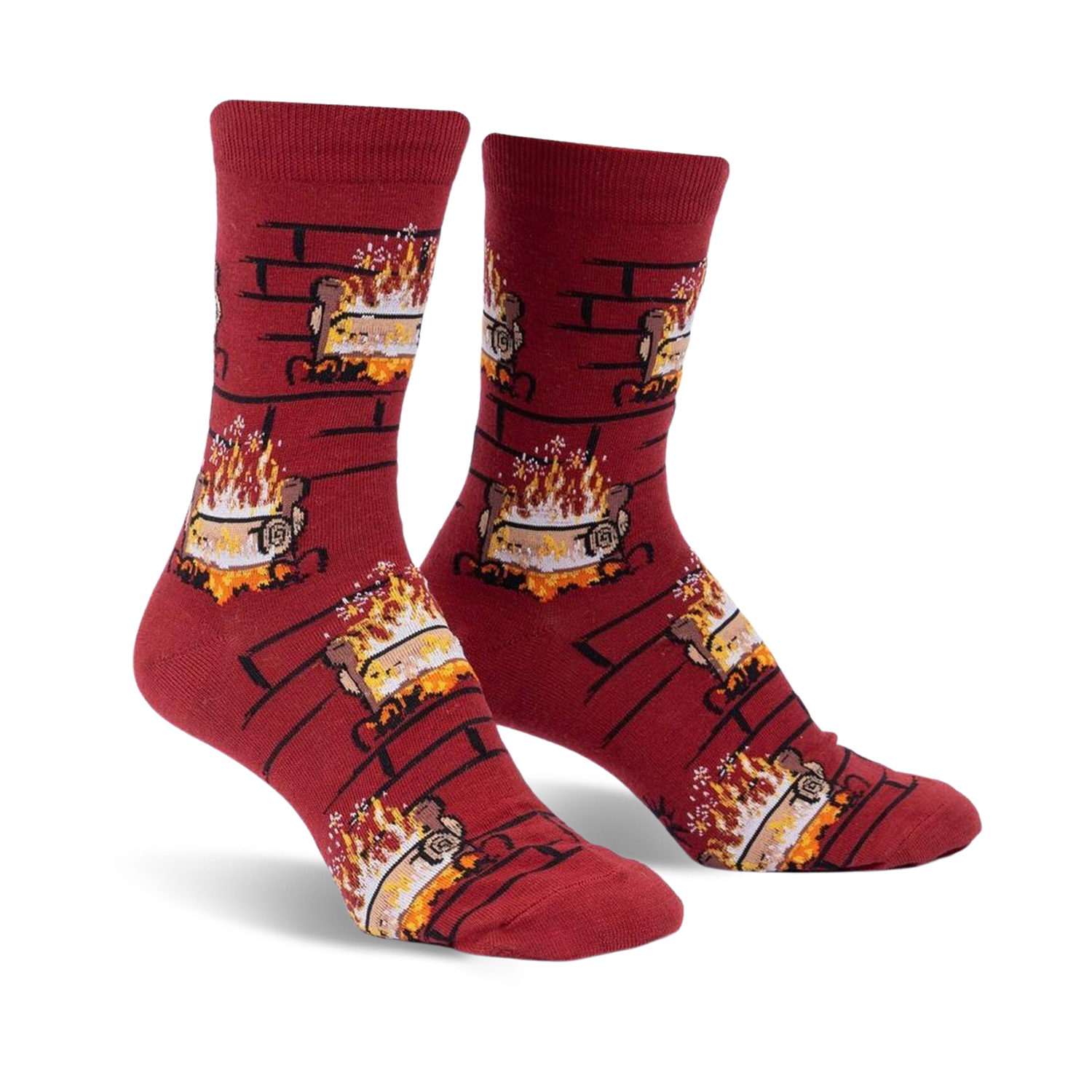 Pair of crew socks in burgundy with a repeating pattern of burning yule logs in a brick fireplace. 