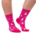 Lifestyle shot showing Feelin' Pine socks on a person's legs against a white background.