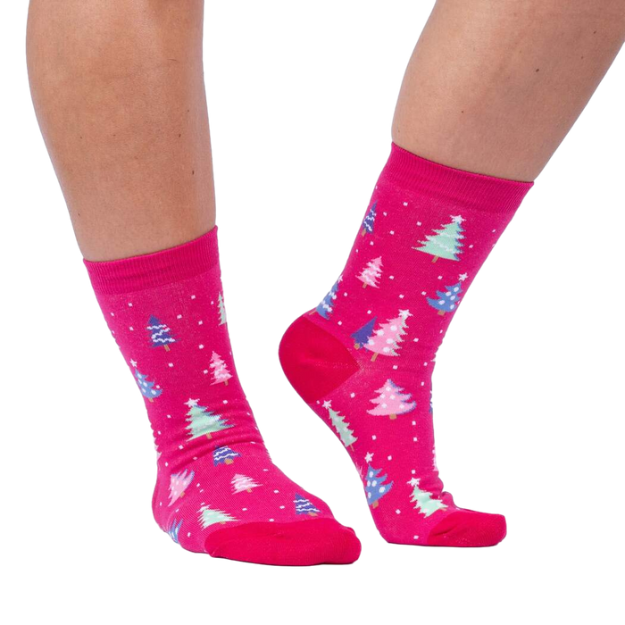 Lifestyle shot showing Feelin' Pine socks on a person's legs against a white background.