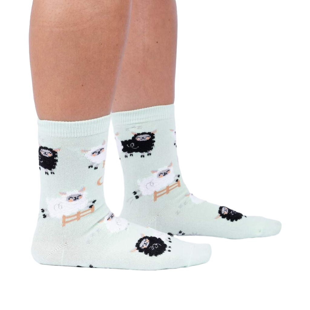 Lifestyle shot of a person wearing the 'You Can Count on Me' socks, showcasing the fit and design on a leg.
