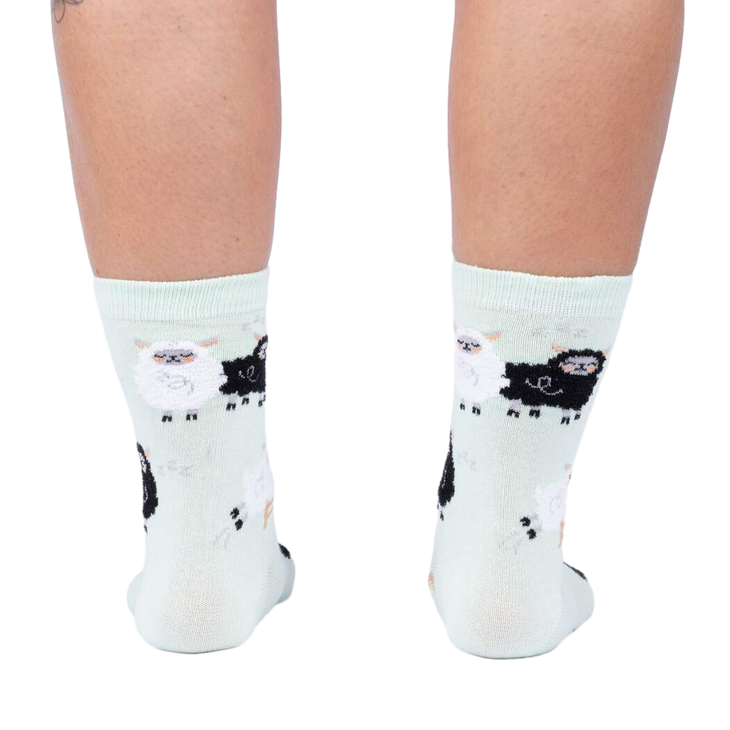 Back view of the socks, highlighting the full pattern design on the mint green fabric.