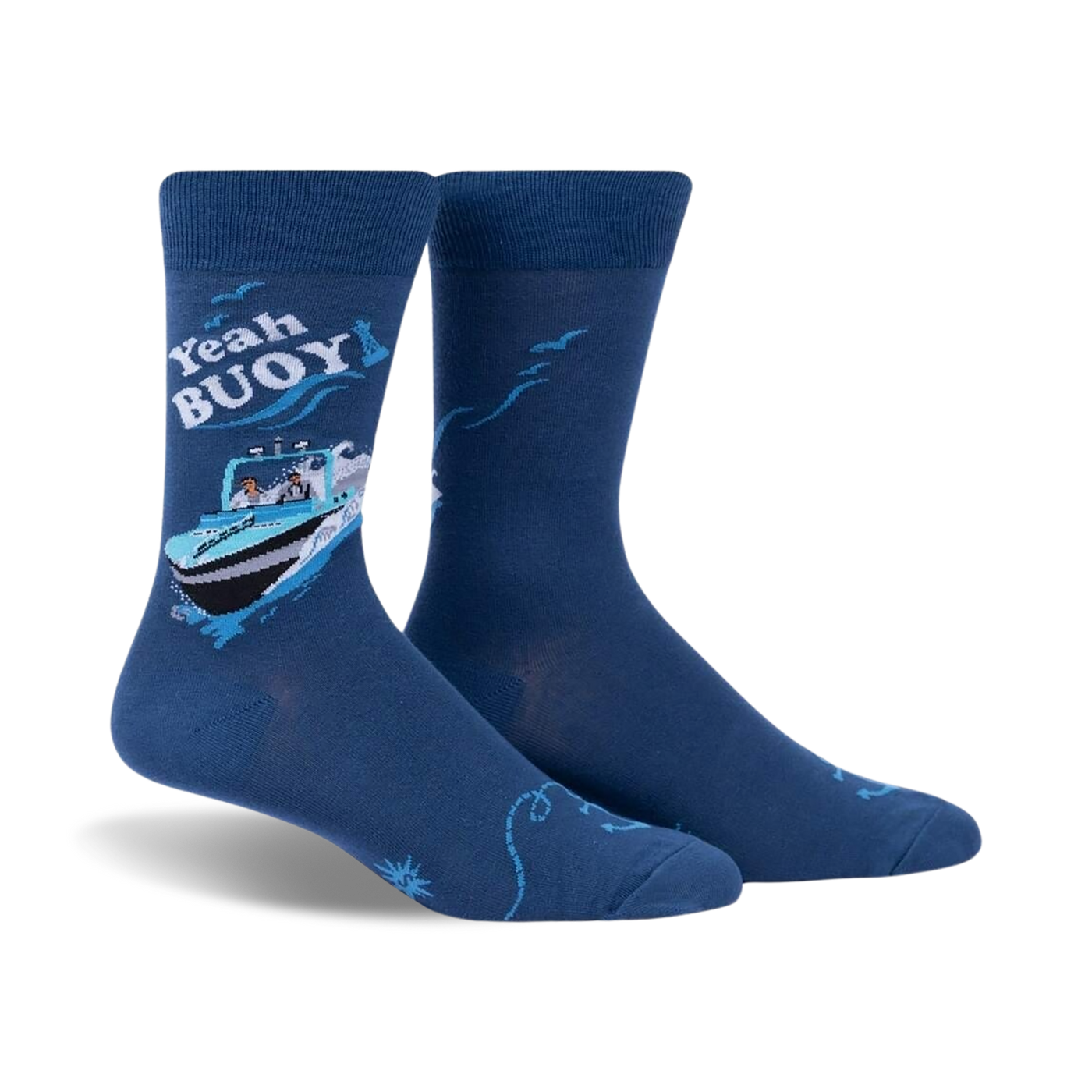 A pair of blue crew socks with a whimsical illustration of a boat, text that says 'Yeah Buoy!', and seagull accents.
