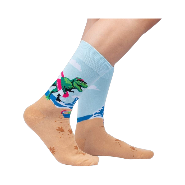 Lifestyle photo showing Dinos Gone Wild socks on a person's feet, showcasing the sock's fit and design on legs.