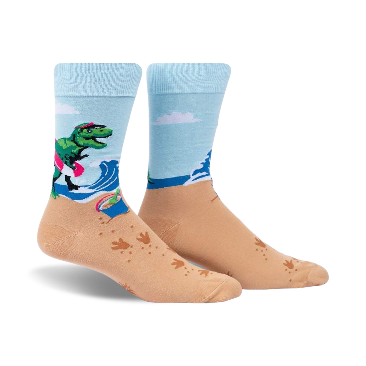 Crew socks in light blue and tan. Design features a T-Rex on a surfboard at the beach with wave and footprint details.