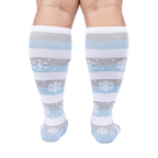 Back view of a person modeling the snowflake and stripe knee-high socks.