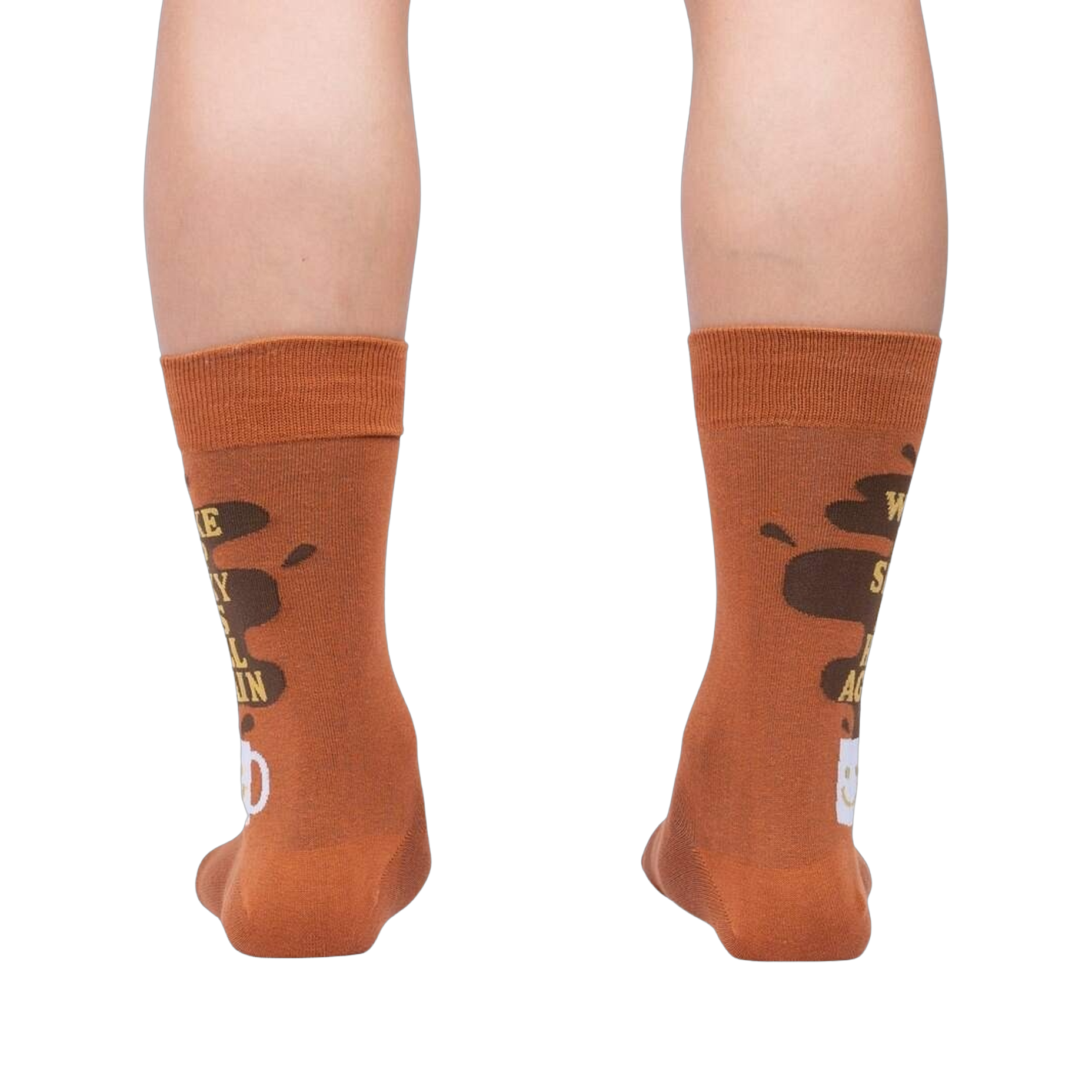 Rear view of the socks on a person's legs, highlighting the back design of the coffee cup and text.