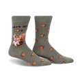 Crew socks in olive green with acorns and a squirrel design.  The text 'Let's Get Nuts' is featured on the sock.