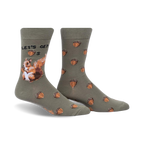 Crew socks in olive green with acorns and a squirrel design.  The text 'Let's Get Nuts' is featured on the sock.