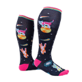 Model wearing Space Cat knee-high socks.  Shows the socks from the side, highlighting their length and design.