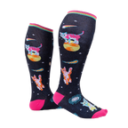 Model wearing Space Cat knee-high socks.  Shows the socks from the side, highlighting their length and design.