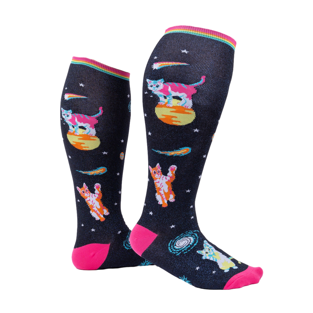 Model wearing Space Cat knee-high socks.  Shows the socks from the side, highlighting their length and design.