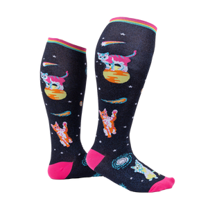 Model wearing Space Cat knee-high socks.  Shows the socks from the side, highlighting their length and design.