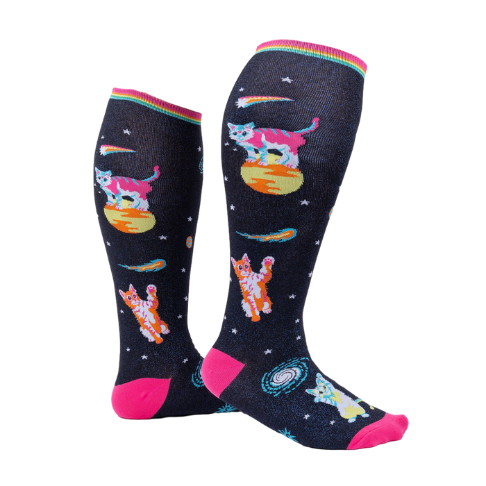 Model wearing Space Cat knee-high socks.  Shows the socks from the side, highlighting their length and design.