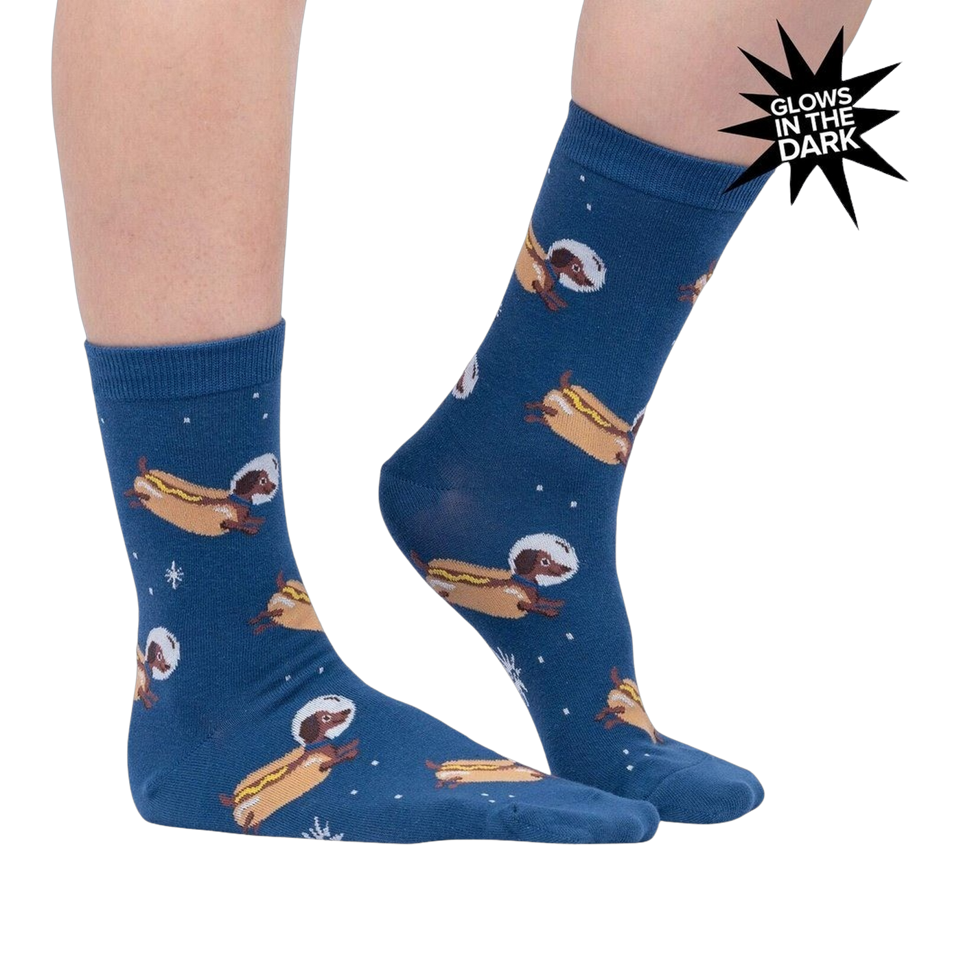 Lifestyle shot of a person wearing the Weiner Dogs, In Space! Glow in the Dark socks. The socks are partially visible.