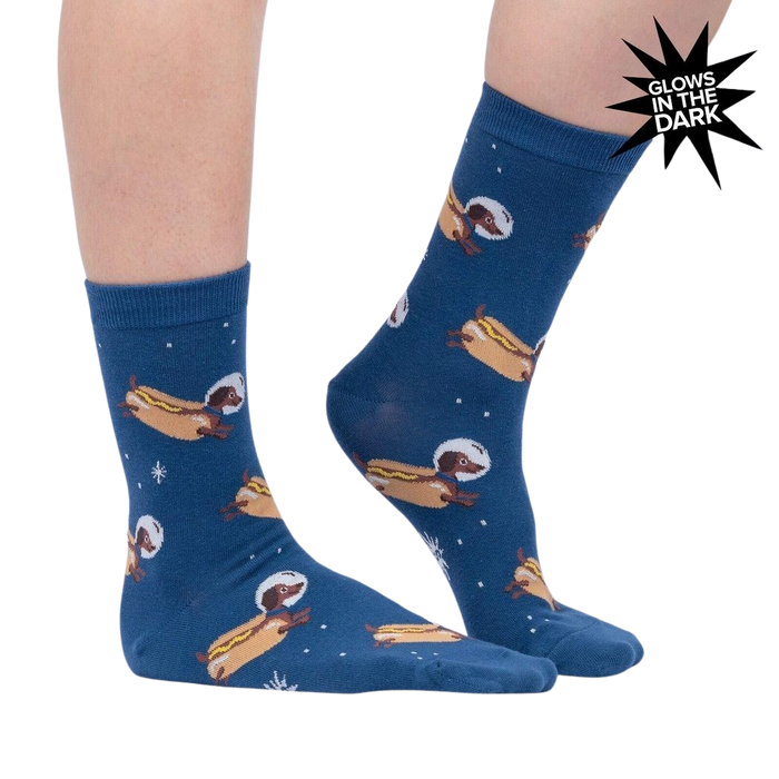 A pair of blue socks with a pattern of hot dogs in space wearing astronaut helmets.