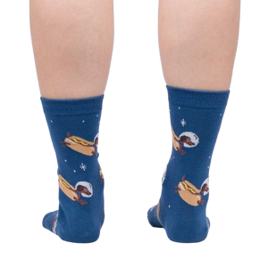 A pair of blue socks with a pattern of hot dogs in space wearing astronaut helmets.