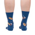 Back view of a person wearing the Weiner Dogs, In Space! Glow in the Dark socks.  Shows full sock pattern on both legs.