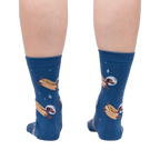 Back view of a person wearing the Weiner Dogs, In Space! Glow in the Dark socks.  Shows full sock pattern on both legs.