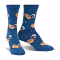 Crew socks in dark blue featuring a repeating pattern of dachshunds dressed as astronauts on hot dogs in space.  Glows in the dark!