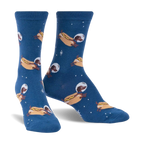 Crew socks in dark blue featuring a repeating pattern of dachshunds dressed as astronauts on hot dogs in space.  Glows in the dark!