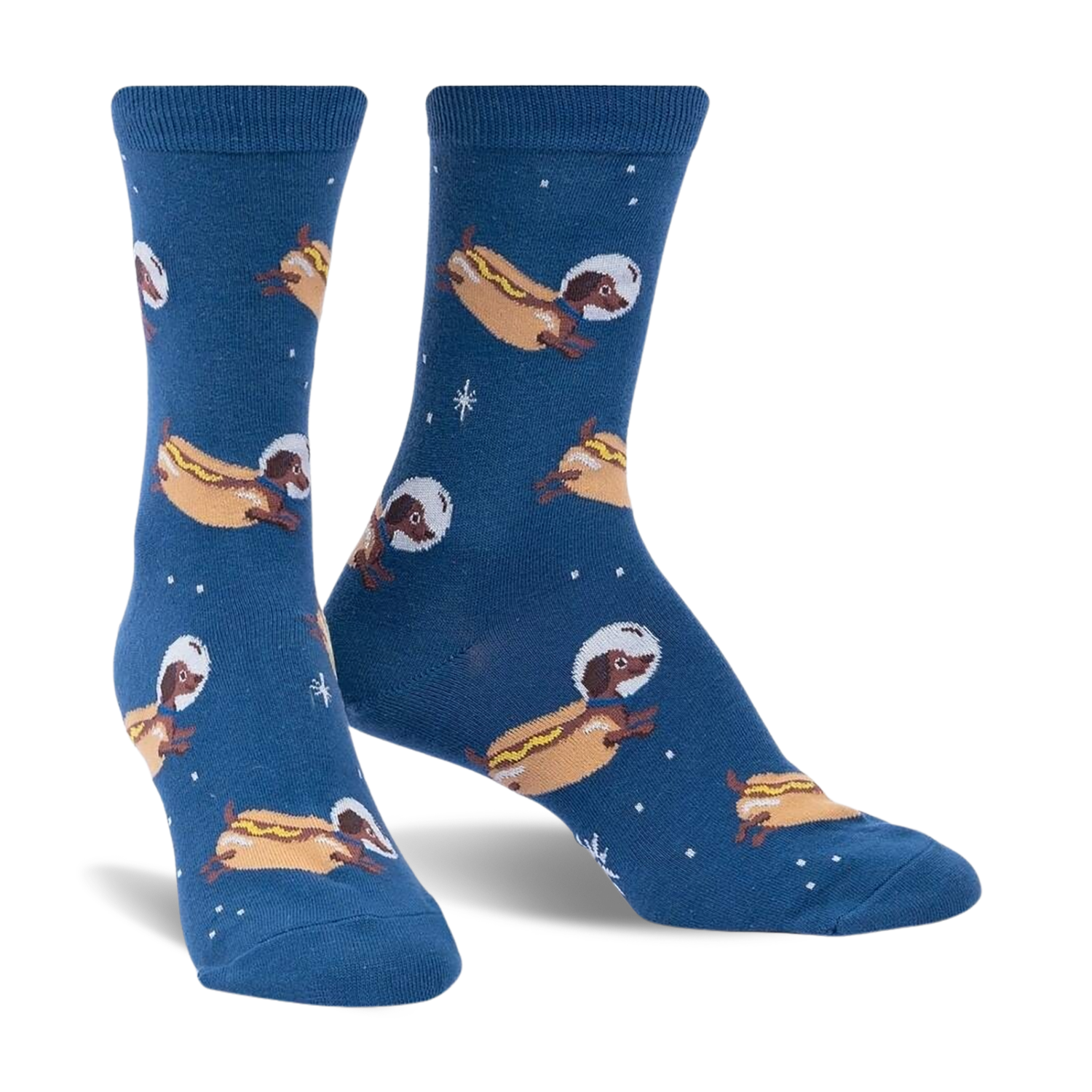 Crew socks in dark blue featuring a repeating pattern of dachshunds dressed as astronauts on hot dogs in space.  Glows in the dark!