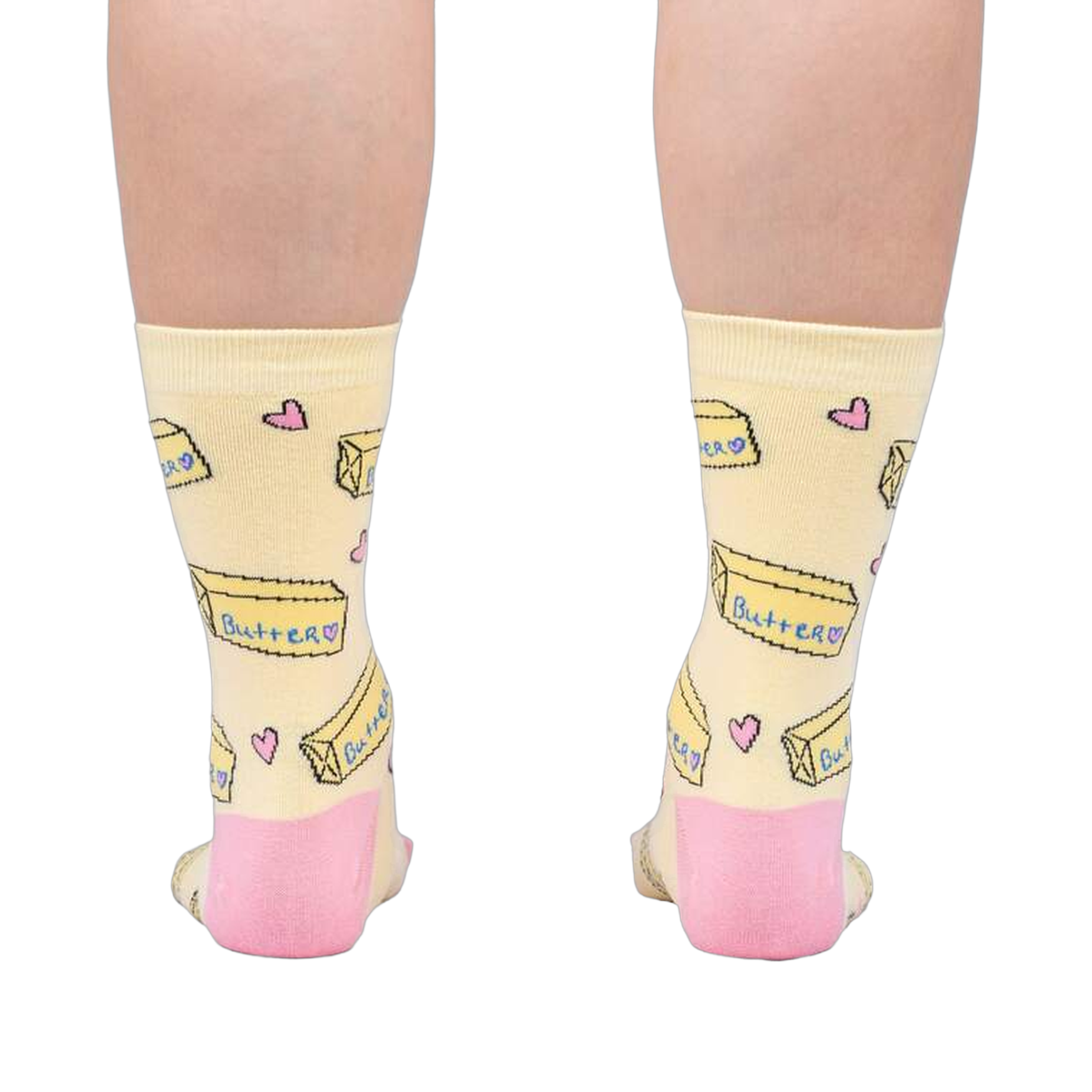 Rear view of the socks on a person's legs, highlighting the pink heel and toe details against the pastel yellow.