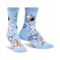 Pair of light blue crew socks with playful illustrations of cats tumbling out of a pill bottle. 