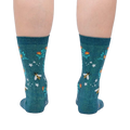 Rear view of the socks on a person's legs, displaying the design from the back.