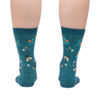 Rear view of the socks on a person's legs, displaying the design from the back.