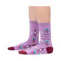 Lifestyle photo showcasing the 'Maybe Wine Will Help' socks on a person's legs.