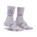 Pair of grey crew socks featuring a pixelated 'WTF?' surrounded by small pink and teal flowers. 