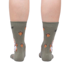Rear view of a person wearing a pair of 'Let's Get Nuts' socks, showcasing the full back design of the socks.