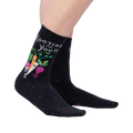 Lifestyle photo showcasing the 'Rooting For You' socks on a person's legs, showing how the socks look when worn.