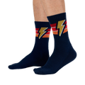 Lifestyle shot of male model wearing navy blue Thunderstruck socks.
