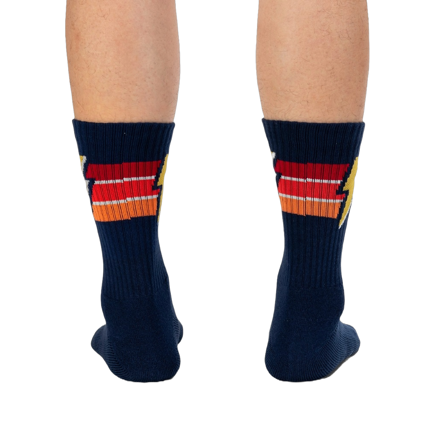 Rear view of navy blue Thunderstruck socks on a person's legs.