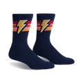 Pair of navy blue crew socks with retro orange, red, and yellow stripes and a lightning bolt design.