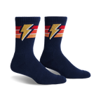Pair of navy blue crew socks with retro orange, red, and yellow stripes and a lightning bolt design.